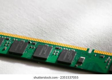 Partial macro photo of a computer RAM memory on a white background