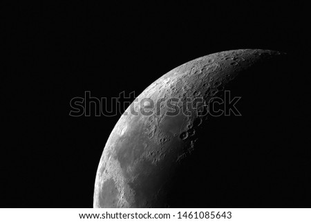 Partial moon shot through telescope.