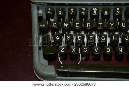 a partial photo of the QWERTY keyboard of an old manual typewriter