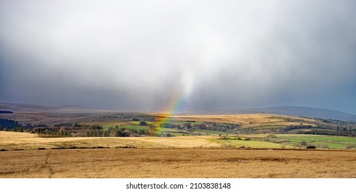 A Partial Rainbow In The Dartmoor National Park In Winter, Devon, England, UK