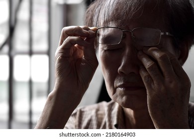 Partial Silhouette Image Of Asian Elder Man Rubbing His Eye. Concept Of Eye Pain, Strain Or Itchy Eyelid.