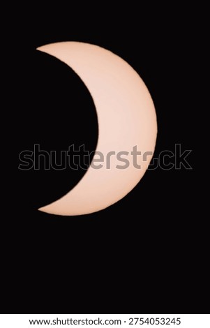 Partial solar eclipse in the dark. Actual image taken through a solar filter.