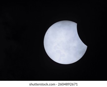 Partial solar eclipse on 29.03.2025 in Germany, northern Germany, near Bremen, veil clouds can be seen in the foreground. - Powered by Shutterstock - Get 15% off with code: PIKWIZARD15