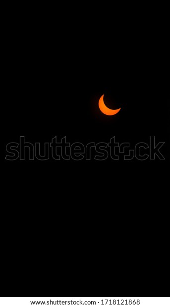 Partial solar eclipse at sun\
isolated on black background with space for text copy. Solar\
eclipse.