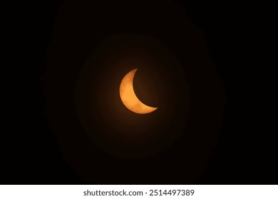 Partial solar eclipse taken with a special camera filter - Powered by Shutterstock