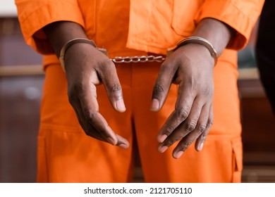 Partial View Of African American Man In Handcuffs And Orange Jail Uniform