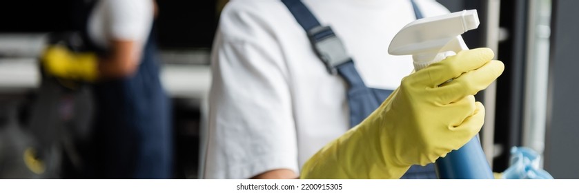 Partial View Of Blurred Cleaner In Rubber Glove Holding Detergent, Banner