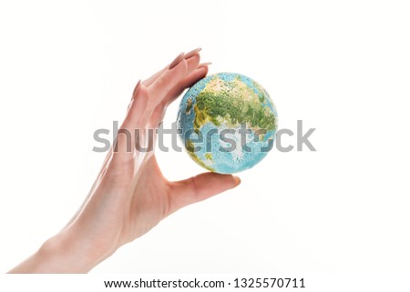 partial view of female hand with earth model isolated on white, global warming concept