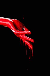 Partial View Of Painted Hand With Red Dripping Paint Isolated On Black