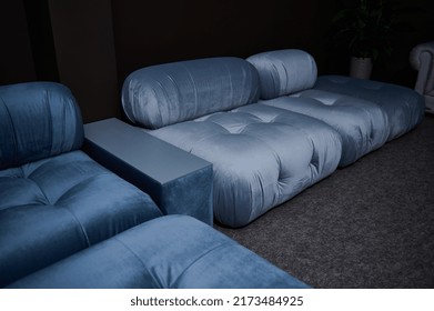 Partial View Of A Stylish Blue Satin Couch Displayed For Sale In A Furniture Design Store. Home Interior Design Concept