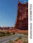 Partial View of Tower of Babel Rock with Road in Arches National Park, Utah, USA on a sunny Day with blue Sky, Wide-Angle