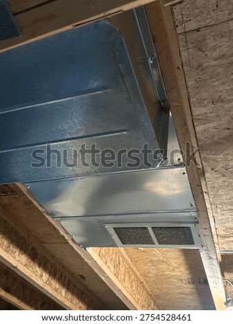 Partially built basement construction space with exposed wood framing concrete floor and unfinished interior structure