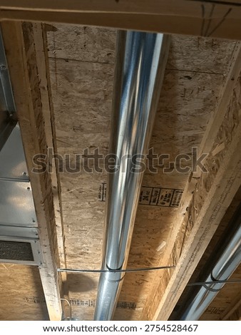 Partially built basement construction space with exposed wood framing concrete floor and unfinished interior structure