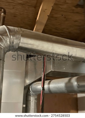 Partially built basement construction space with exposed wood framing concrete floor and unfinished interior structure