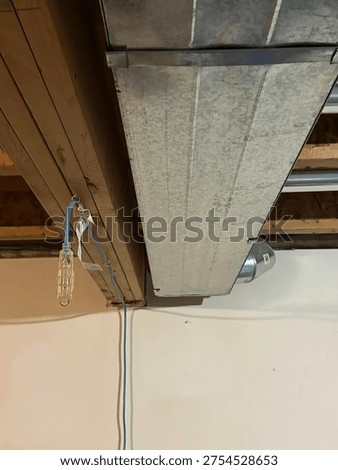 Partially built basement construction space with exposed wood framing concrete floor and unfinished interior structure
