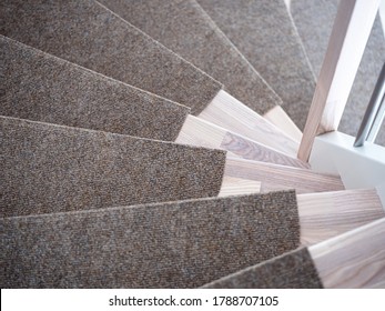 Partially Carpeted wooden stairs in a house