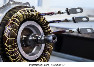 Partially disassembled for repair IPM-SynRM (Internal Permanent Magnet Synchronous Reluctance Motor) motor of an moder electric vehicle. EV maintenance, service; repair concept;