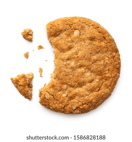 Partially Eaten Crunchy Oat And Wholemeal Biscuit With Crumbs Isolated On White. Top View.