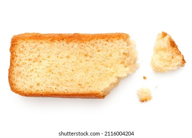 Partially eaten slice of plain sponge cake lying flat isolated on white. With crumbs. Top view. - Shutterstock ID 2116004204