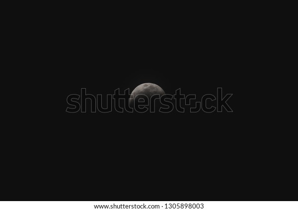 Partially Eclipsed Moon, from January\'s Super Blood\
Wolf Moon lunar eclipse,\
2019.