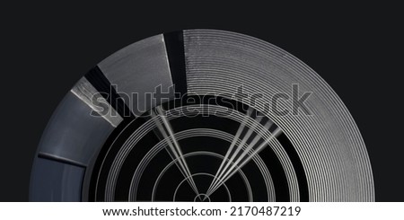 Partially isolated metal panels resembling futuristic architecture or hi-tech dome ceiling. Geometric structure with round pattern and radial lines. Abstract material background.