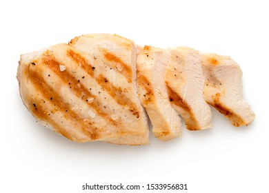 Partially Sliced Grilled Chicken Breast With Grill Marks, Ground Black Pepper And Salt Isolated On White. Top View.