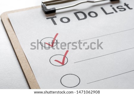 Partially ticked off to do list on a clipboard
