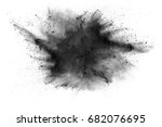 particles of charcoal on white background,abstract powder splatted background,Freeze motion of black powder exploding or throwing black powder.
