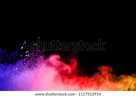 particles of charcoal on white background,abstract powder splatted background.Freeze motion of black powder exploding or throwing black powder.