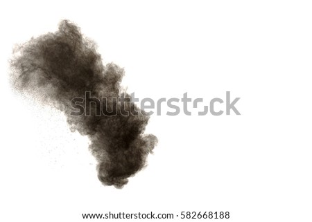 particles of charcoal on white background,abstract powder splatted background,Freeze motion of black powder exploding or throwing black powder.