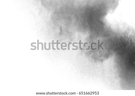 particles of charcoal on white background,abstract powder splatted on white background,Freeze motion of black powder exploding.
