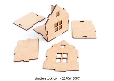 Partly Assembled Toy Wooden House Kit Isolated On White Background. Buying A Prefabricated Home.