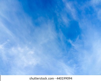 Partly Cloudy In Blue Sky.