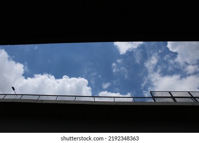 Partly Cloudy Day Under A Bridge.