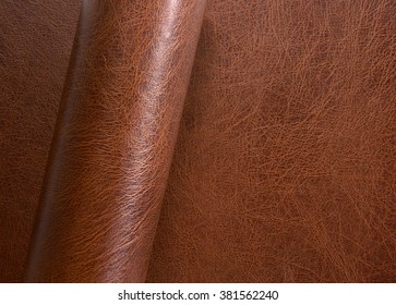 partly rolled full frame brown leather surface