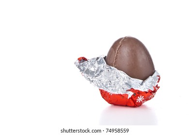 partly unwrapped chocolated easter egg isolated - Powered by Shutterstock