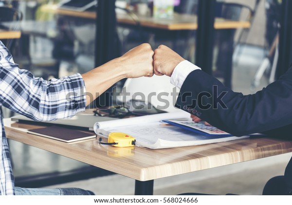 Partner Business Trust Teamwork Partnership.\
Industry contractor fist bump dealing mission business. Mission\
team meeting group of People Fist bump Hands together. Business\
industry trust teamwork