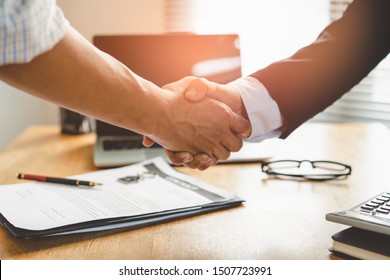 Partners corporate relationship concept. Close up handshake of business people in meeting attendance.
