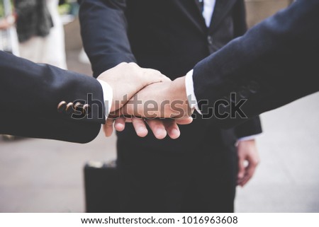 Partners Team work joining hands to success together.  Business Team stack of hands for star up project.  Team work Concept