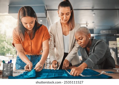 Partners, women and cutting fabric as fashion designer at office with patterns or clothes for project . Startup, employees and creative director with teamwork, collaboration and coworking as stylist - Powered by Shutterstock