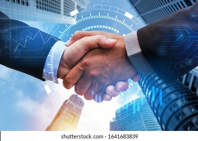 Partnership. business man handshake with digital network link connection, graph chart of stock market graphic diagram and city background, digital technology, internet communication, teamwork concept - Powered by Shutterstock