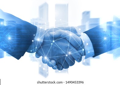 Partnership - business man shaking hands with effect digital network link connection graphic diagram, digital global technology with cityscape background, internet communication and teamwork concept - Shutterstock ID 1490453396