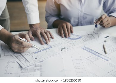 The partnership engineering man or co-workers working on a project and discussing together with looking at blueprint paperwork. - Powered by Shutterstock