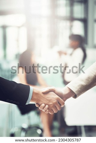 Partnership, handshake and business people in office for a deal, collaboration or corporate meeting. Teamwork, introduction and closeup of employees shaking hands for greeting or welcome in workplace