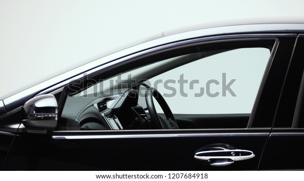 Parts of automotive car black color such as
window, wheel, lamp, mirror, side shots shooting from front and
rear on white background in studio production and for use in
automobile industry.