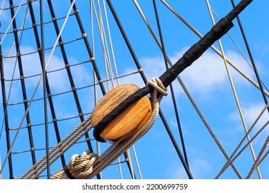 Parts Of An Old Wooden Deadeye On The Shrouds Of A Sailing Schooner, Guys Main Mast. Ship Rigging, Shrouds And Lanyards Of An Old Wooden Ship