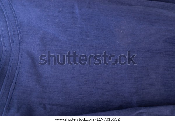 Parts of a sewn, blue skirt.\
Fabric sewn into the product. Crumpled fabric. White\
background.