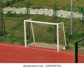 Parts of the soccer goal. Two posts, sidebar and net. Football. Mini, red field . Popular game. Stip, 2023. Macedonia.