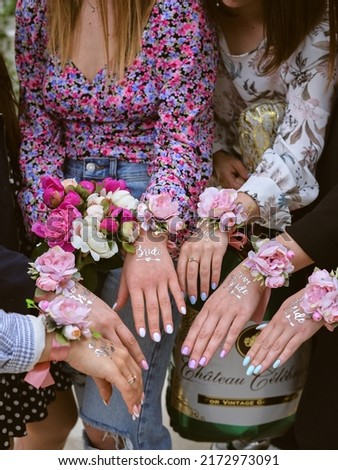 Party attributes in the style of the bride's bachelorette party. Hands of the young girls before the wedding day. Hen party