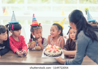 Party Birthday Kid Asian With Cake In Room. Group Of Children Happy Surprise. 